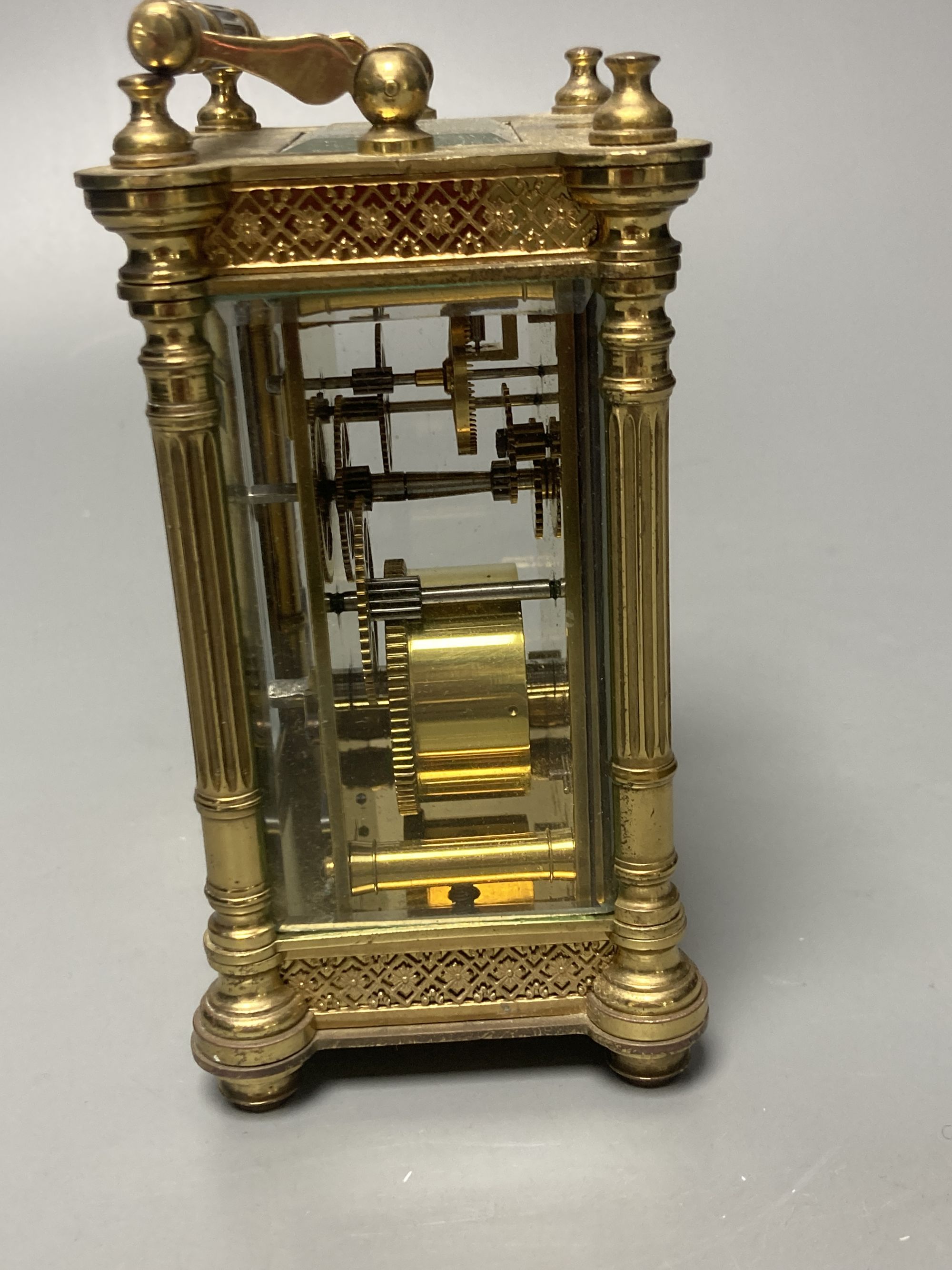 An early 20th century French ornate brass carriage timepiece, height 13cm